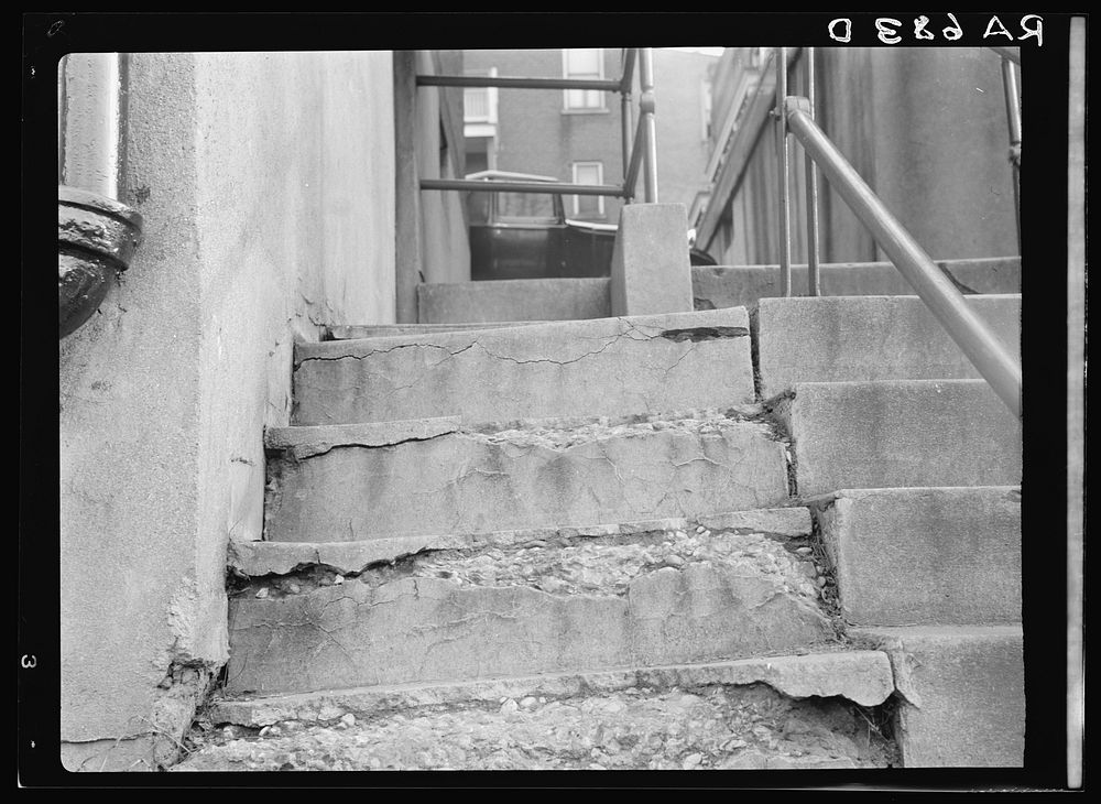 View showing disintegration of concrete stairs at the Model Housing Corporation, Cincinnati, Ohio. Sourced from the Library…