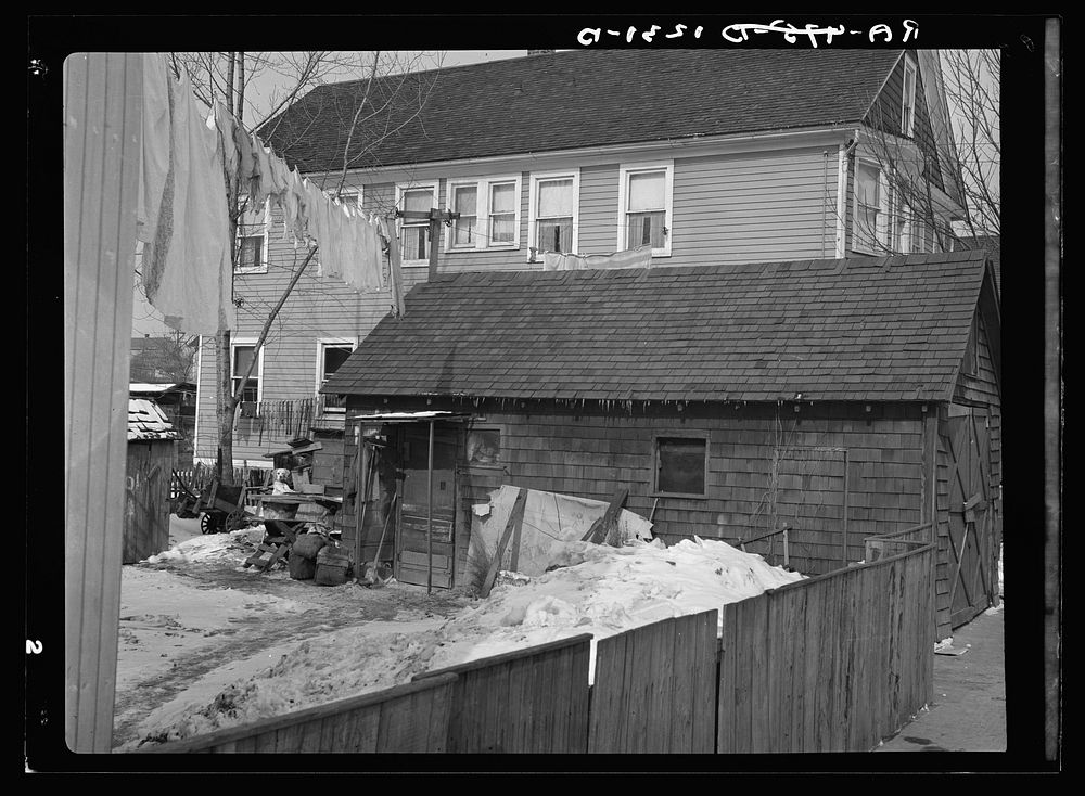 Garage in foreground is home of white family, man and wife. Manville, New Jersey. Sourced from the Library of Congress.