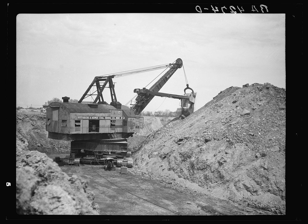 Strip mining operations with a thirty-two cubic yard steam shovel. Cherokee County, Kansas. Sourced from the Library of…