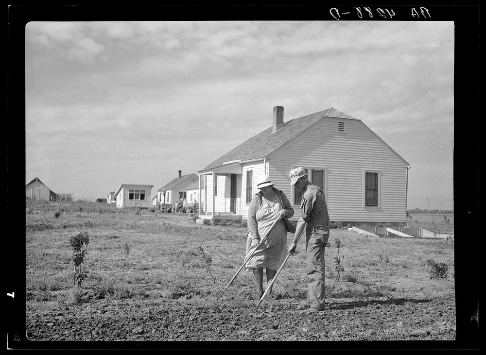 Working in garden. Falls City Farmsteads, Nebraska. Sourced from the Library of Congress.