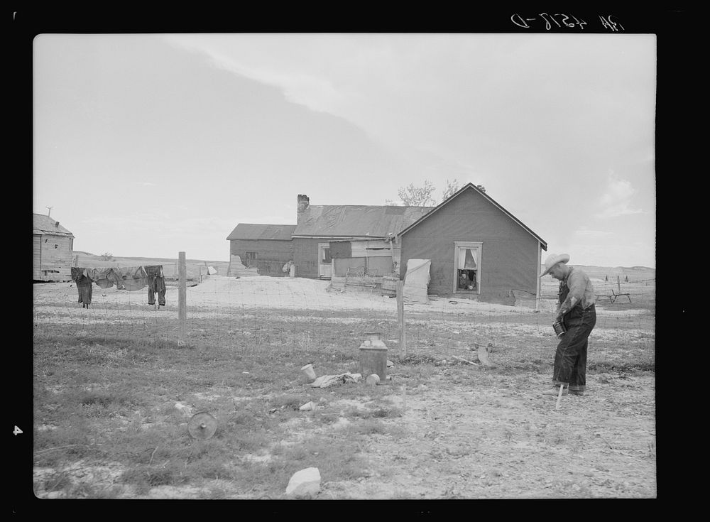 Type of house and farmer to be removed from land development area. Pennington County, South Dakota. Sourced from the Library…