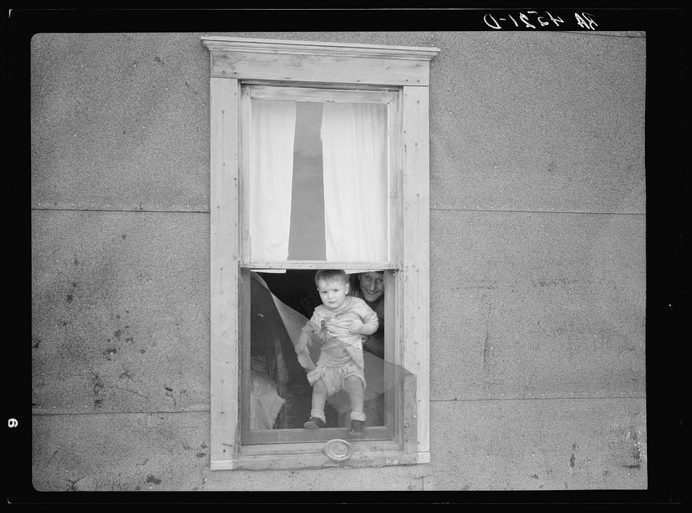 Child of family living in land development area. Pennington County, South Dakota. Sourced from the Library of Congress.