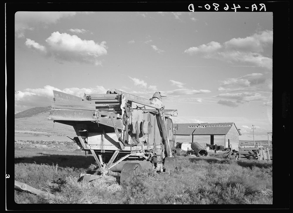 Rusting combines testify to unprofitable years of wheat farming in central Oregon. Sourced from the Library of Congress.