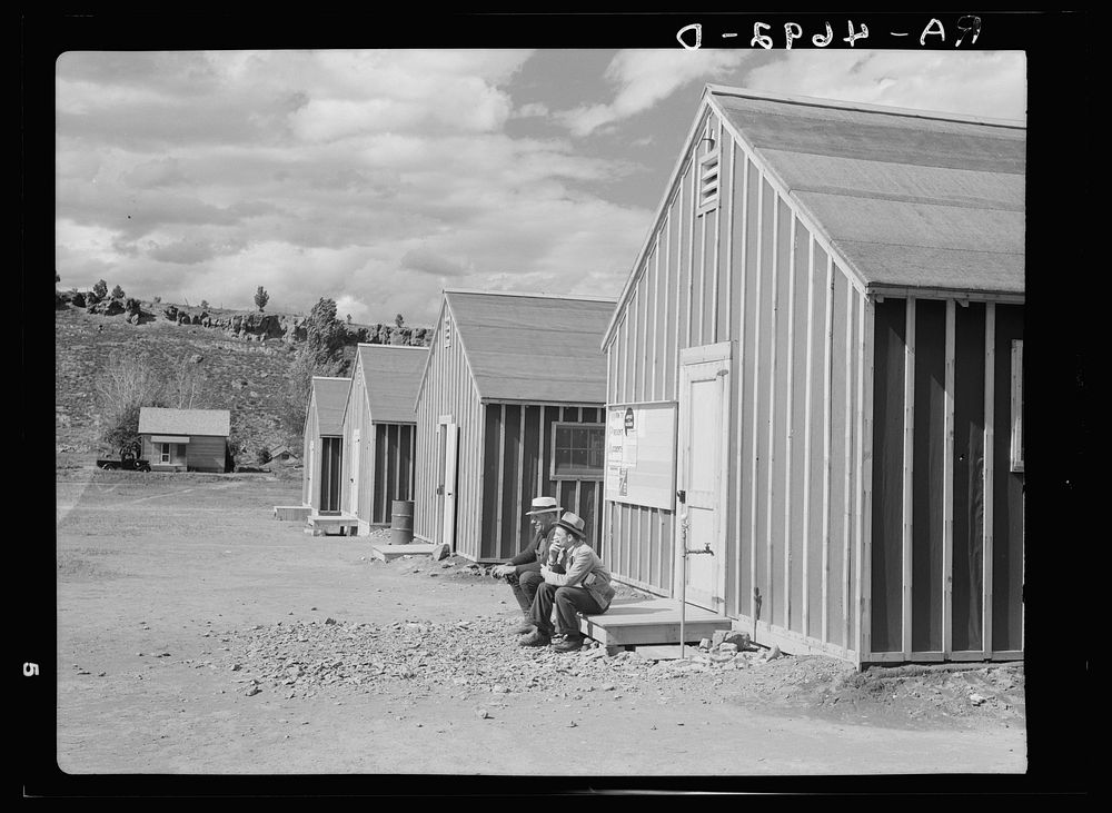 Looking down a row of bunkhouses in the Rimrock Development Camp of the Resettlement Administration in central Oregon.…