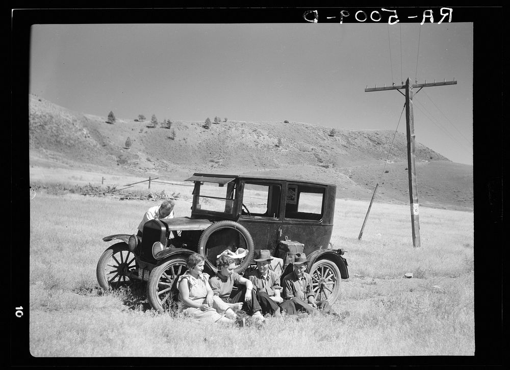 Vernon Evans and family of Lemmon, South Dakota, near Missoula, Montana, Highway 10. Leaving the grasshopper-ridden and…