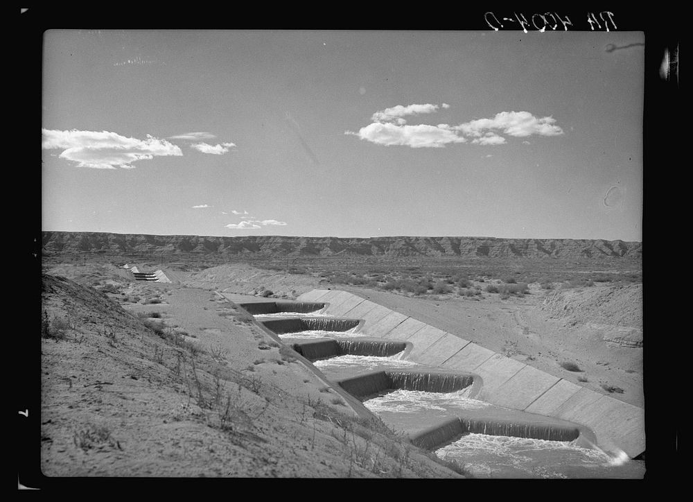 Water from the Rio Grande flowing through an irrigation canal. Sierra County, New Mexico. Sourced from the Library of…