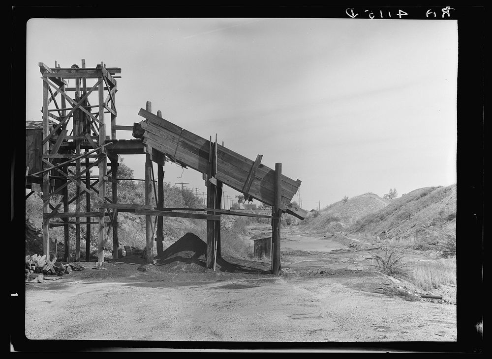 Coal mine with strip mining dumps in background. A problem in destructive land use. Cherokee County, Kansas. Sourced from…
