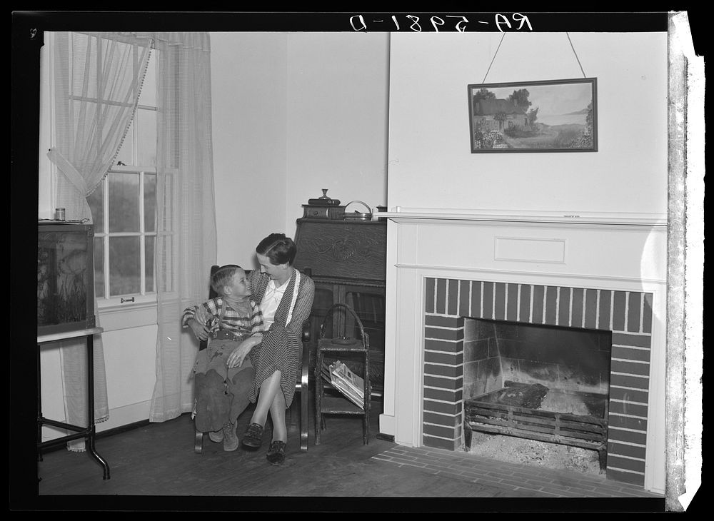 Mrs. L.C. Glenn and son in their new home at Greenwood, Alabama. Sourced from the Library of Congress.