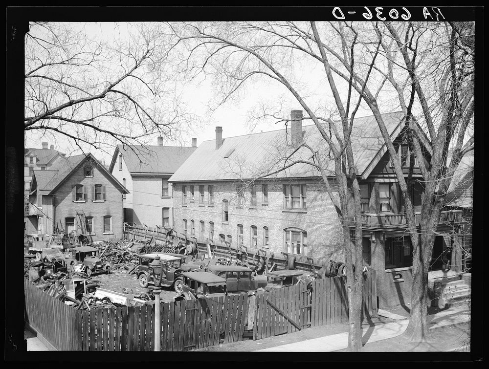 1535 North 10th Street. House next to junk yard. Milwaukee, Wisconsin. Sourced from the Library of Congress.