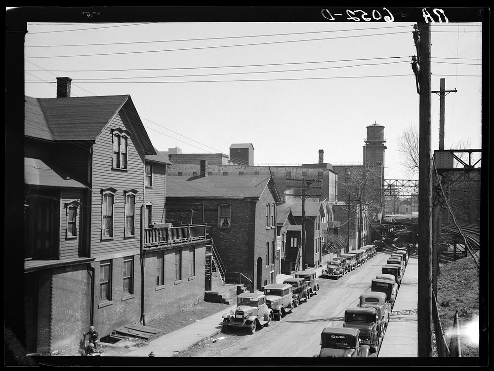 Residential houses crowded in industrial district. Milwaukee, Wisconsin. Sourced from the Library of Congress.