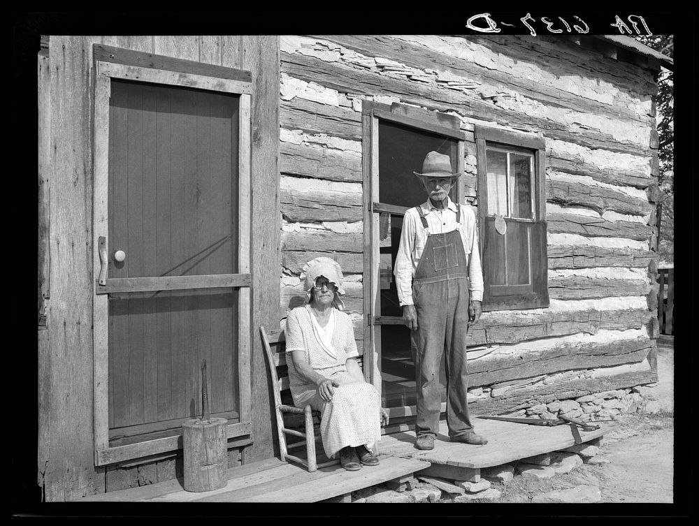 Nick Phillips, eighty-one years old with wife in front of house. Ashland, Missouri. Missouri game and arboretum project.…