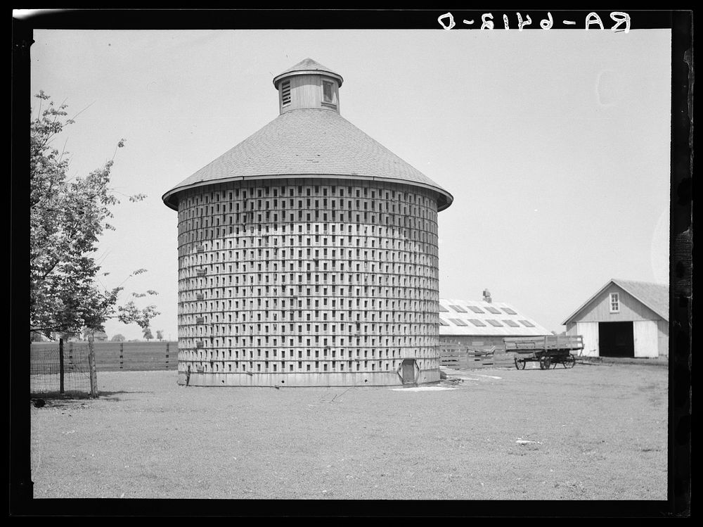 Corn crib of concrete blocks, capacity 7000 bushels, harvest of 140 acres. Central Illinois. Sourced from the Library of…