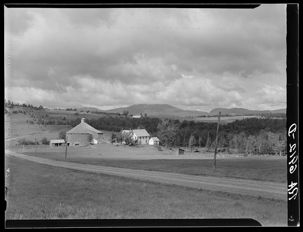 Old red barn and farmhouse near Lowell, Vermont. Sourced from the Library of Congress.