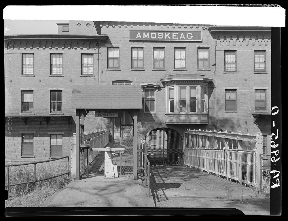 One of the employees' entrances on Canal Street of the Amoskeag mills. Manchester, New Hampshire. Sourced from the Library…