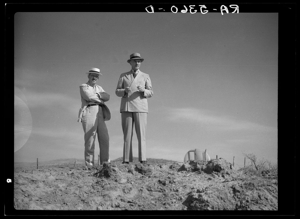Morris Cooke and Colonel Harrington inspect a stock water dam. Campbell County, Wyoming. Sourced from the Library of…