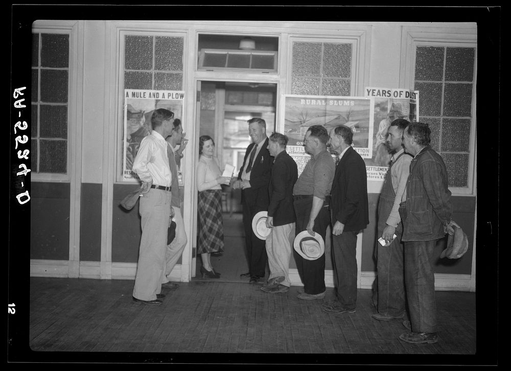 Resettlement clients arrive at the Resettlement Administration office after tobacco sale to make payments on their loans.…