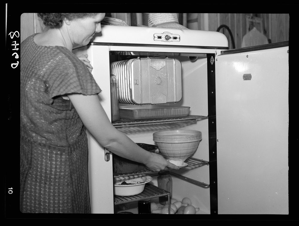 Mrs. Foster at her electric refrigerator. Irwinville Farms, Georgia. Sourced from the Library of Congress.