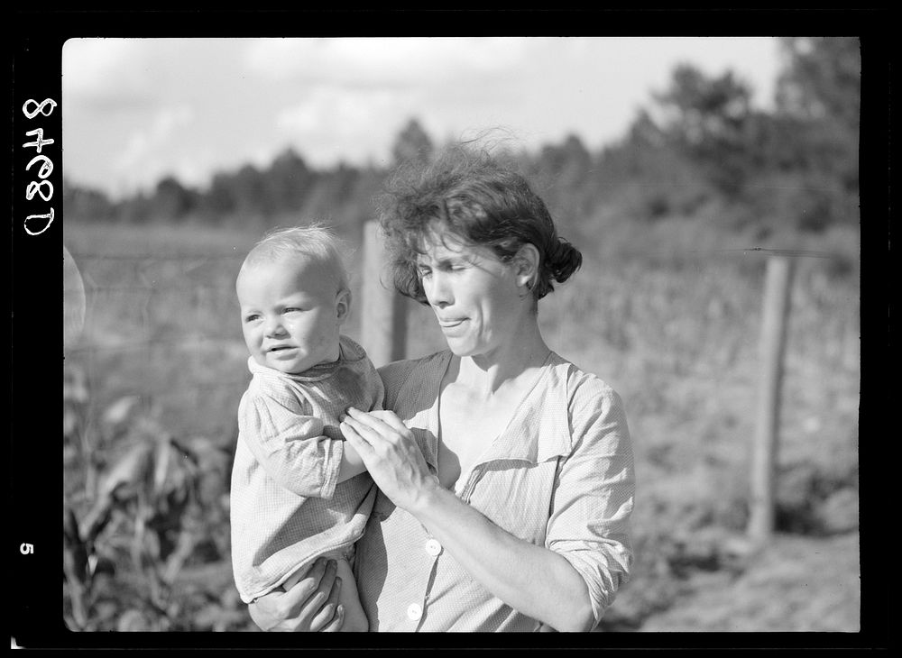 Wife and child of farmer. Irwinville Farms, Georgia. Sourced from the Library of Congress.