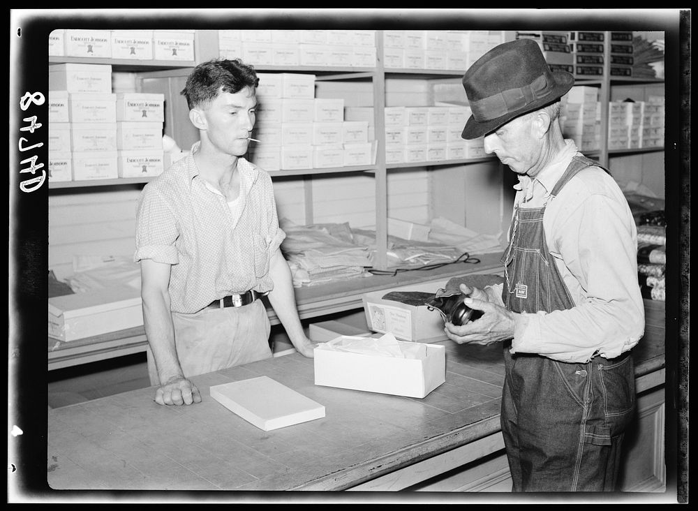 Buying shoes in the cooperative store at Irwinville Farms, Georgia. Sourced from the Library of Congress.