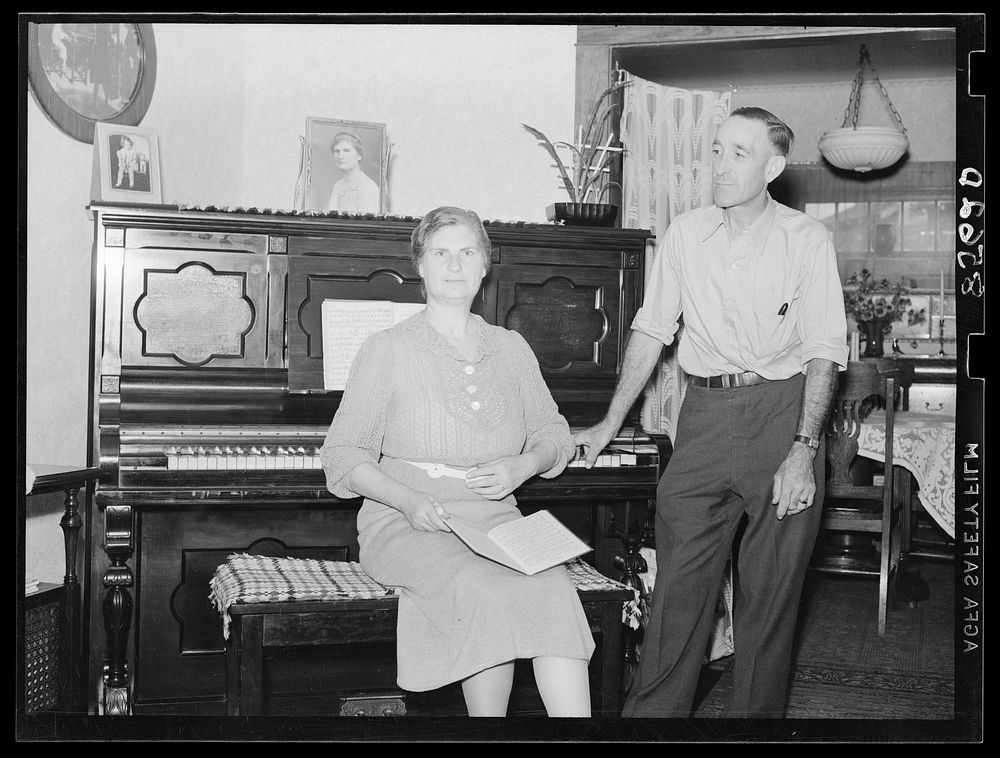 Mr. and Mrs. L.H. Adams in their home near Burlington, New Jersey. Adams is the first farmer in Region I to receive a loan…