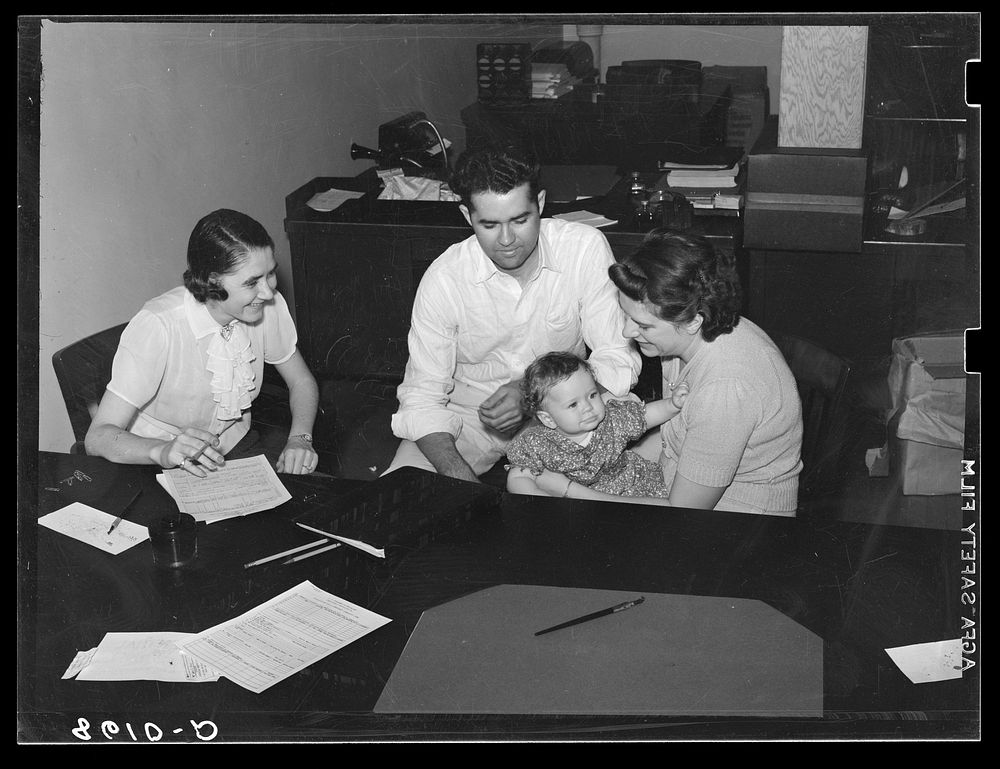 Prospective tenants of Greenhills project being interviewed in family selection office. Ohio. Sourced from the Library of…