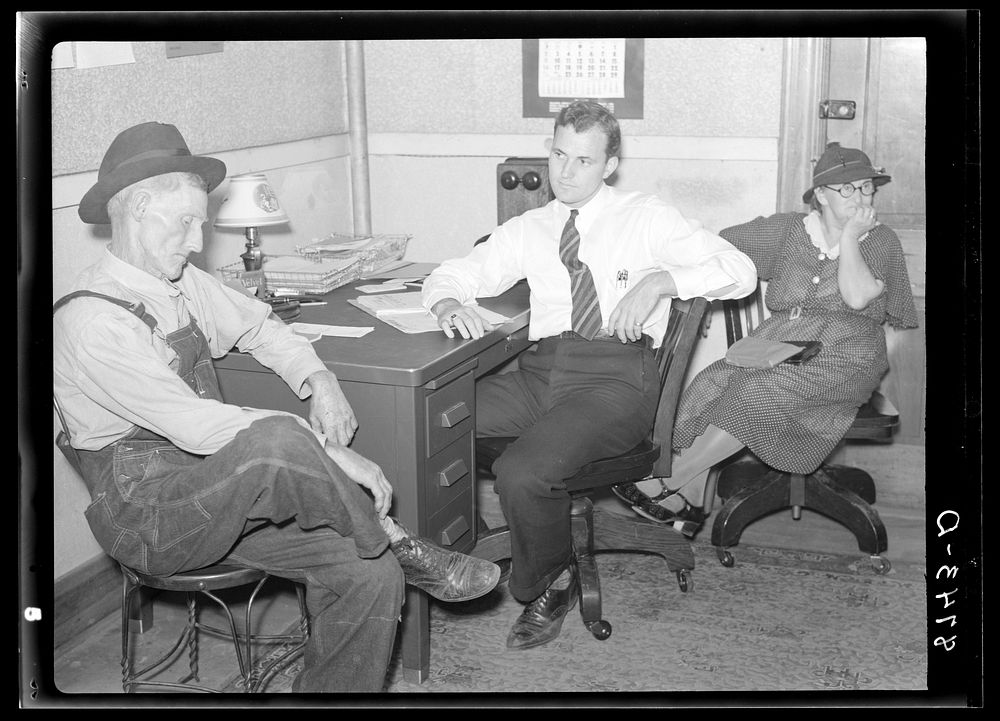 Farmer applying to county supervisor for Farm Security Administration loan. Oskaloosa, Kansas. Sourced from the Library of…