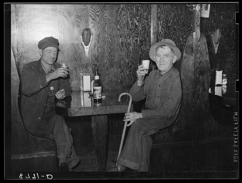Farmer and ex-cowboy drinking beer in North Platte, Nebraska, saloon. Sourced from the Library of Congress.