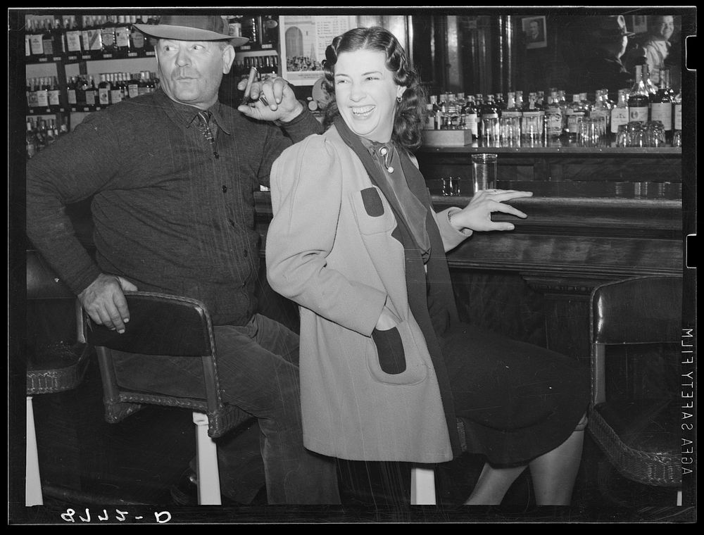 Man and girl at the bar. Saloon in North Platte, Nebraska. Sourced from the Library of Congress.