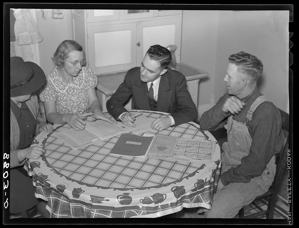 County supervisor working on farm plan with rehabilitation clients. Otoe County, Nebraska. Sourced from the Library of…