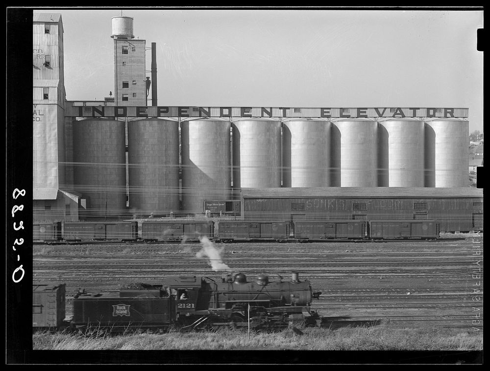 Grain elevators along railroad tracks. Omaha, Nebraska. Sourced from the Library of Congress.