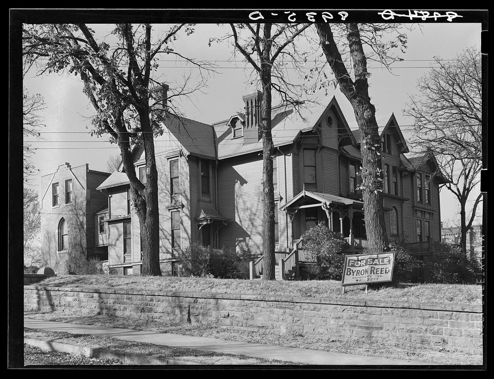 Old house for sale. Note livery stable in rear. Omaha, Nebraska. Sourced from the Library of Congress.