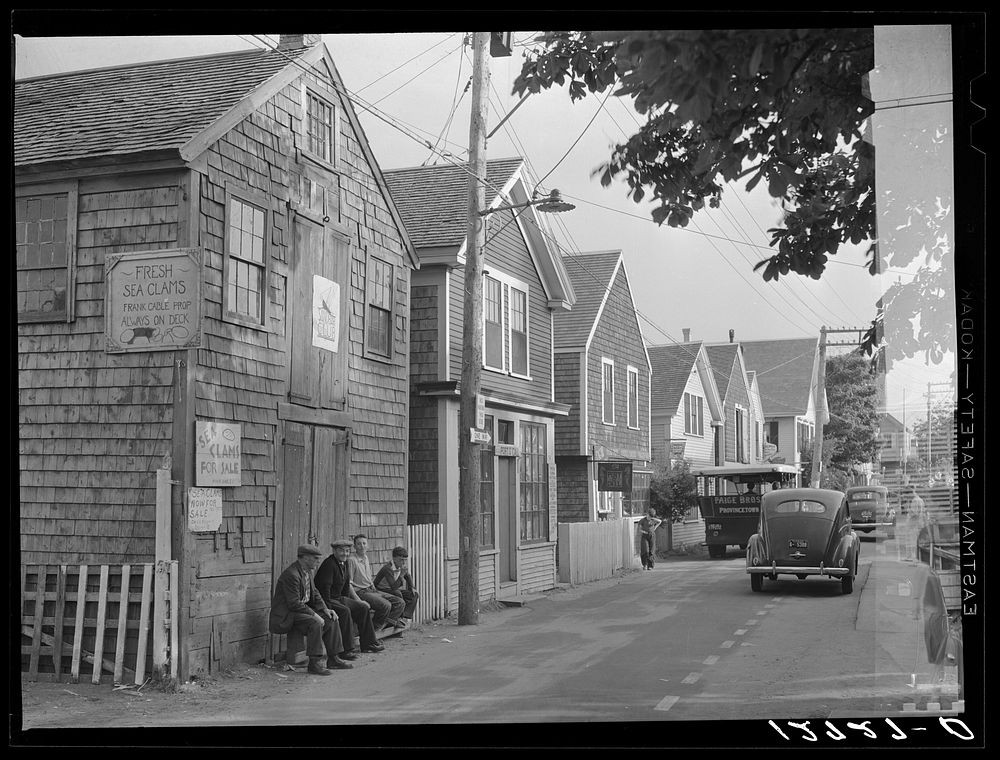 Commercial Street, the main street of Provincetown which runs along the waterfront, including a view of the "Sand Bar Club"…