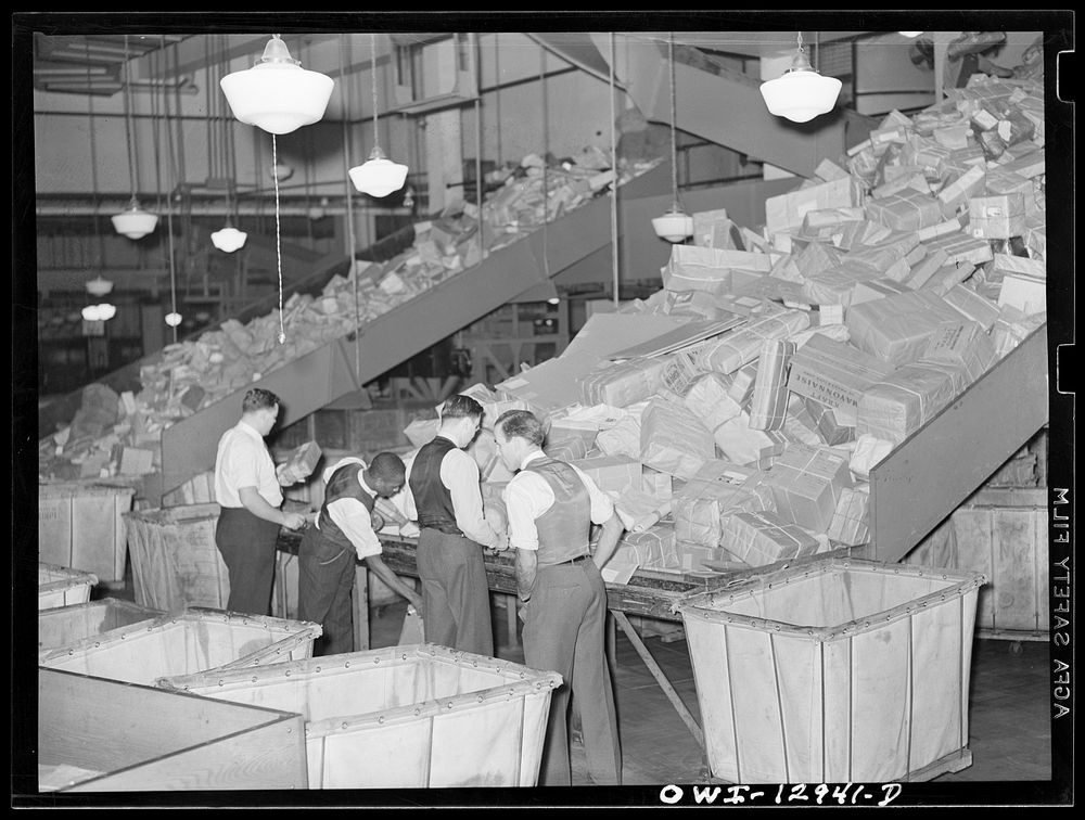 Washington, D.C. Handling Christmas packages at the main post office. Sourced from the Library of Congress.