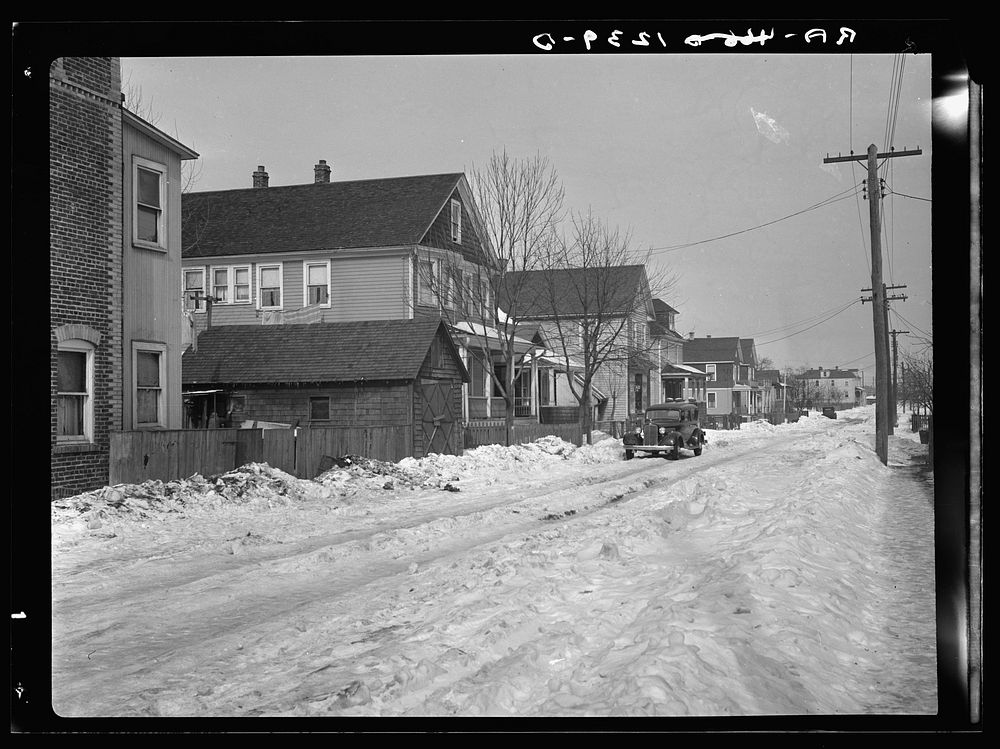 [Untitled photo, possibly related to: Garage in foreground is home of white family, man and wife. Manville, New Jersey].…