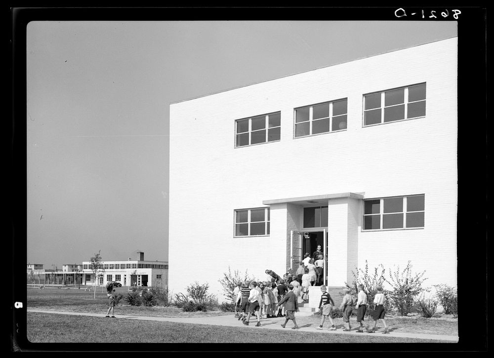 [Untitled photo, possibly related to: Children going in after recess. Greenhills, Ohio]. Sourced from the Library of…