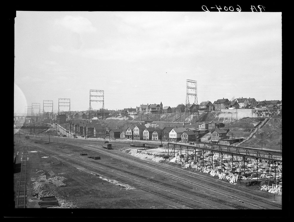 [Untitled photo, possibly related to: Milwaukee freight yards and industrial plants overshadowed by residential district.…