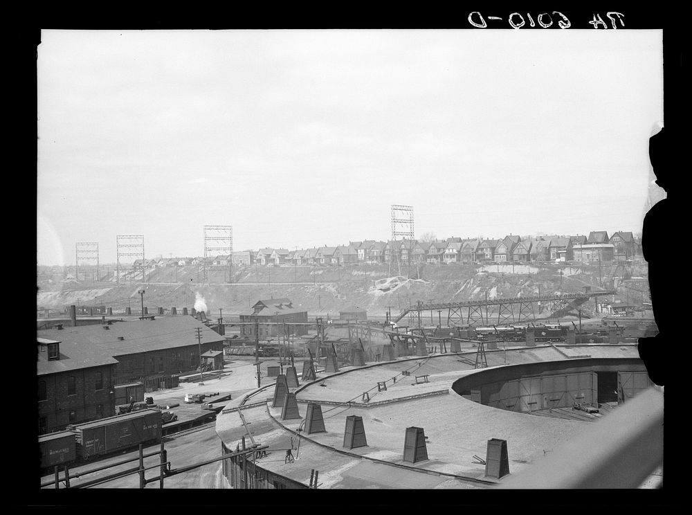 [Untitled photo, possibly related to: Milwaukee freight yards and industrial plants overshadowed by residential district.…