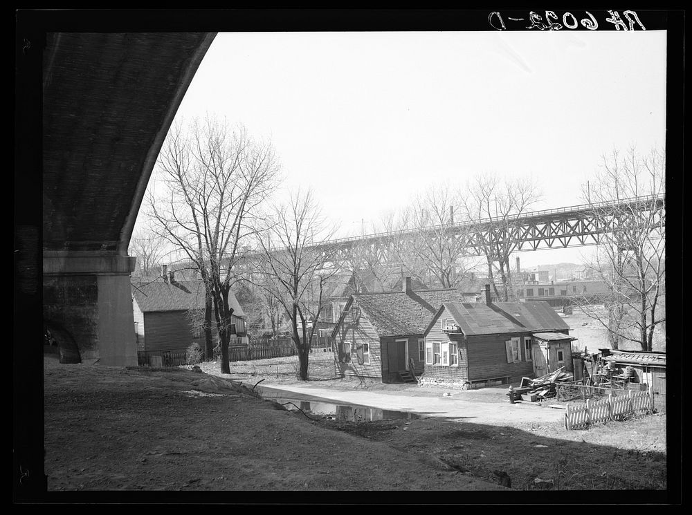 [Untitled photo, possibly related to: Housing under Wisconsin Avenue viaduct. Milwaukee, Wisconsin]. Sourced from the…