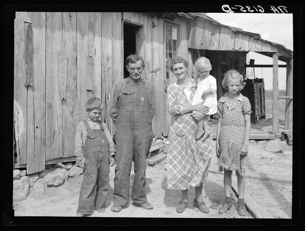 [Untitled photo, possibly related to: Part of John Cain family who live in this three-room house near Ashland, Missouri.…