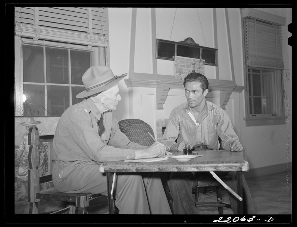 Brownsville, Texas. Retired army officer registering men for Selective Service at the Chamber of Commerce. Sourced from the…