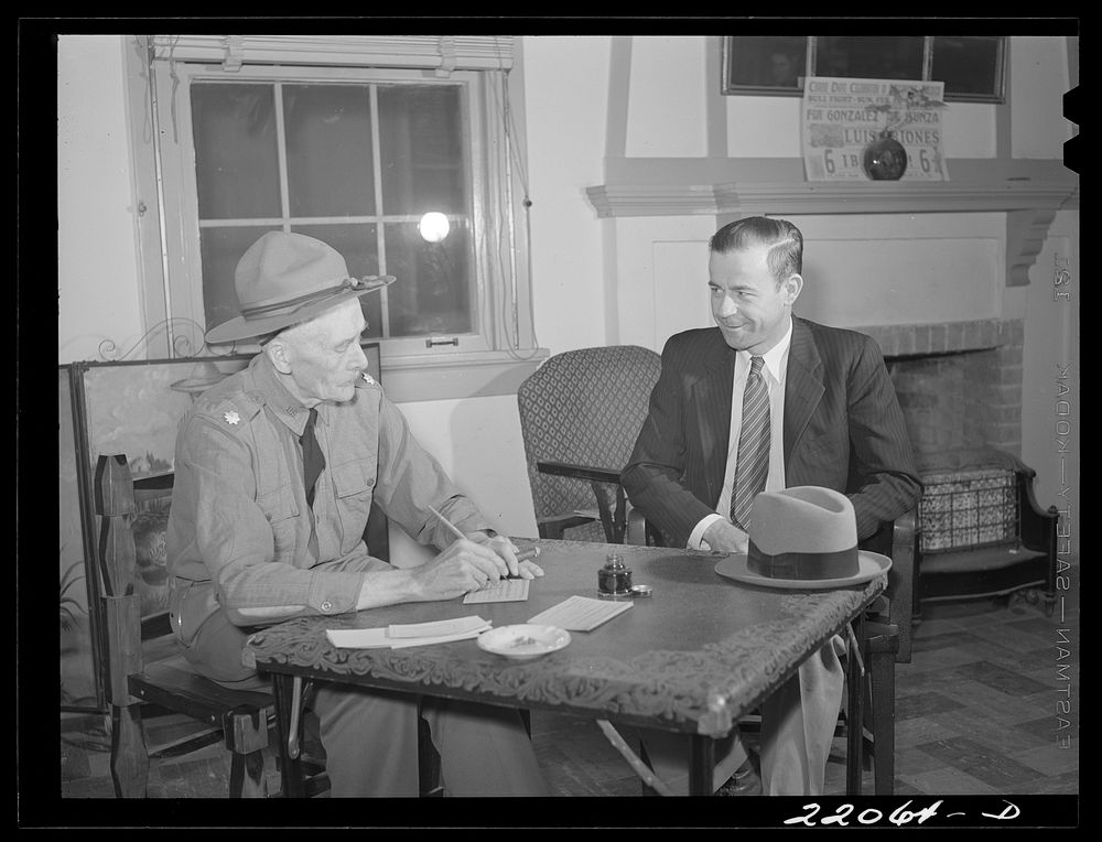 Brownsville, Texas. Retired army officer registering men for Selective Service at the Chamber of Commerce. Sourced from the…