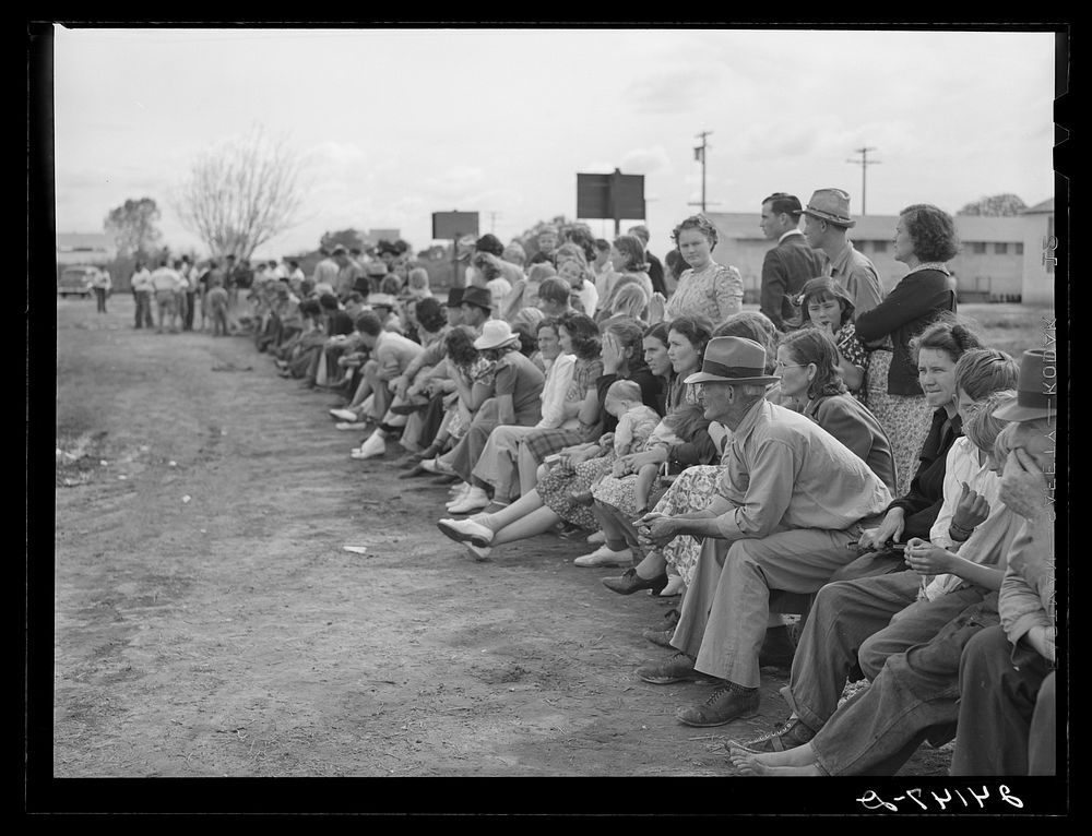 [Untitled photo, possibly related to: Watching baseball game. Tulare migrant camp. Visalia, California]. Sourced from the…