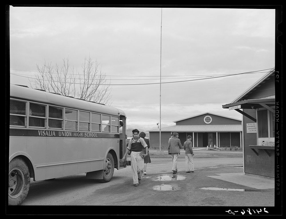 [Untitled photo, possibly related to: Migrant high school students arriving home from school. Tulare migrant camp. Visalia…