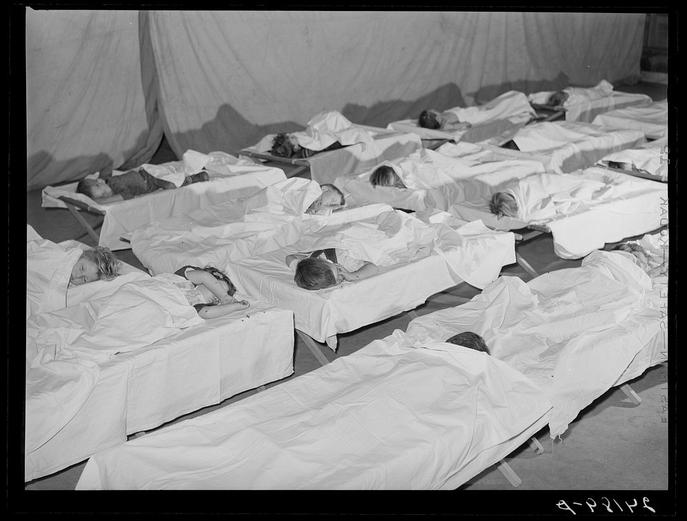 Rest period in nursery. Tulare migrant camp. Visalia, California. Sourced from the Library of Congress.