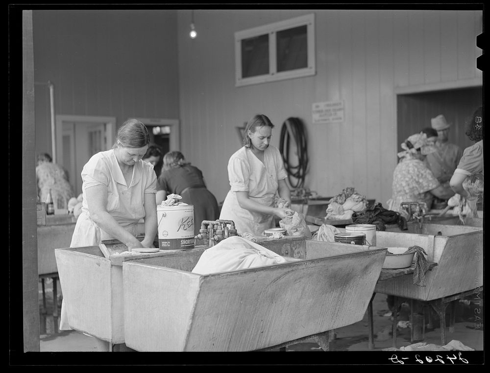 Women washing clothes. Tulare migrant camp. Visalia, California. Sourced from the Library of Congress.