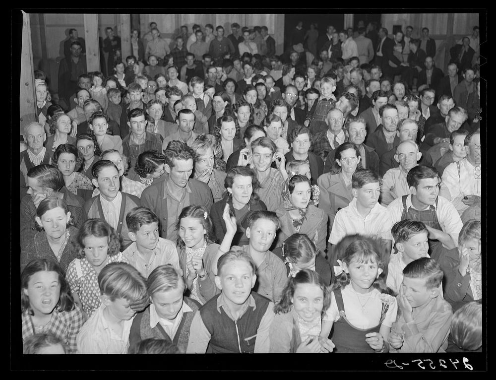 Audience watching play given by Arvin camp. Tulare migrant camp. Visalia, California. Sourced from the Library of Congress.