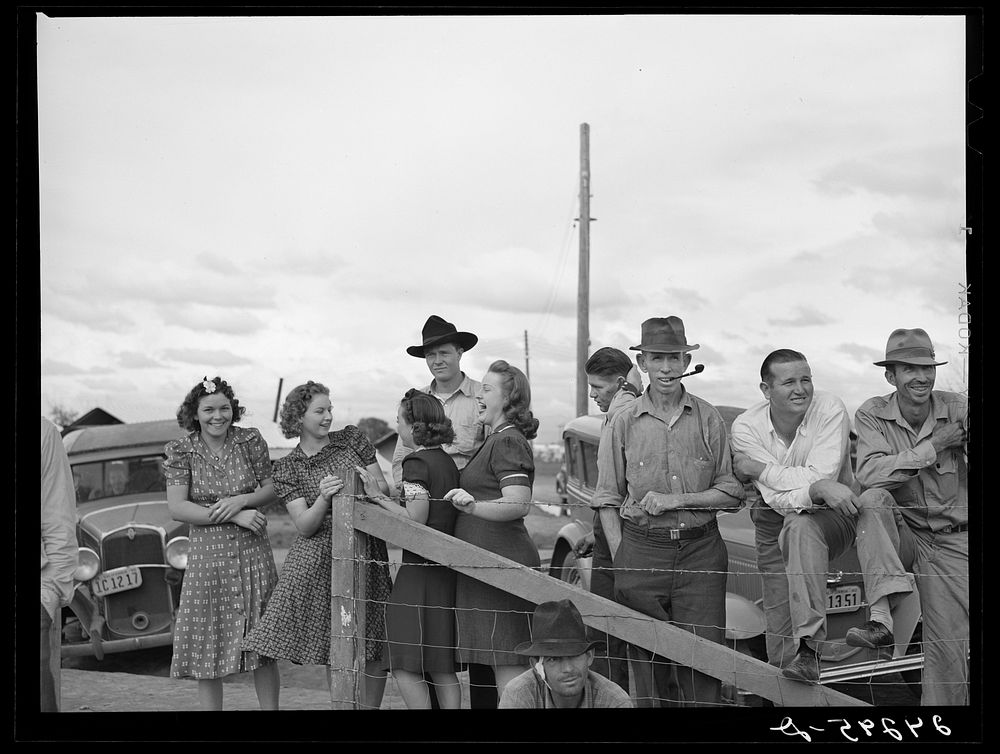 [Untitled photo, possibly related to: Watching a Sunday afternoon baseball game. Tulare migrant camp. Visalia, California].…