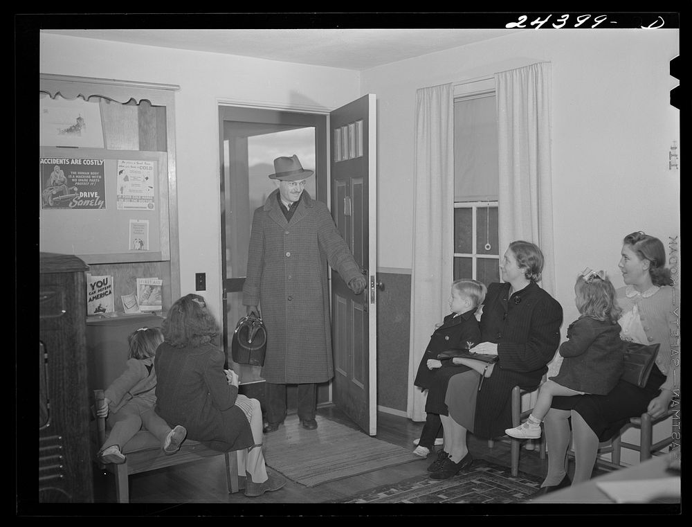 Doctor Tabor entering health center to give inoculations against measles to a group of children. West Virginia. Sourced from…