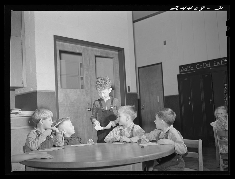 Nursery school group drawing pictures. Homestead school, Dailey, West Virginia. Sourced from the Library of Congress.