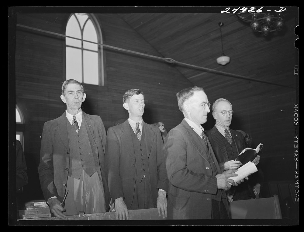 Elders singing hymn at Sunday school, at Baptist church near project.  Dailey, West Virginia. Sourced from the Library of…